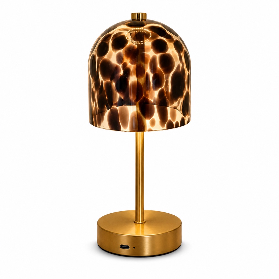 Amber tortoiseshell glass table lamp with a brass-tone stem and base